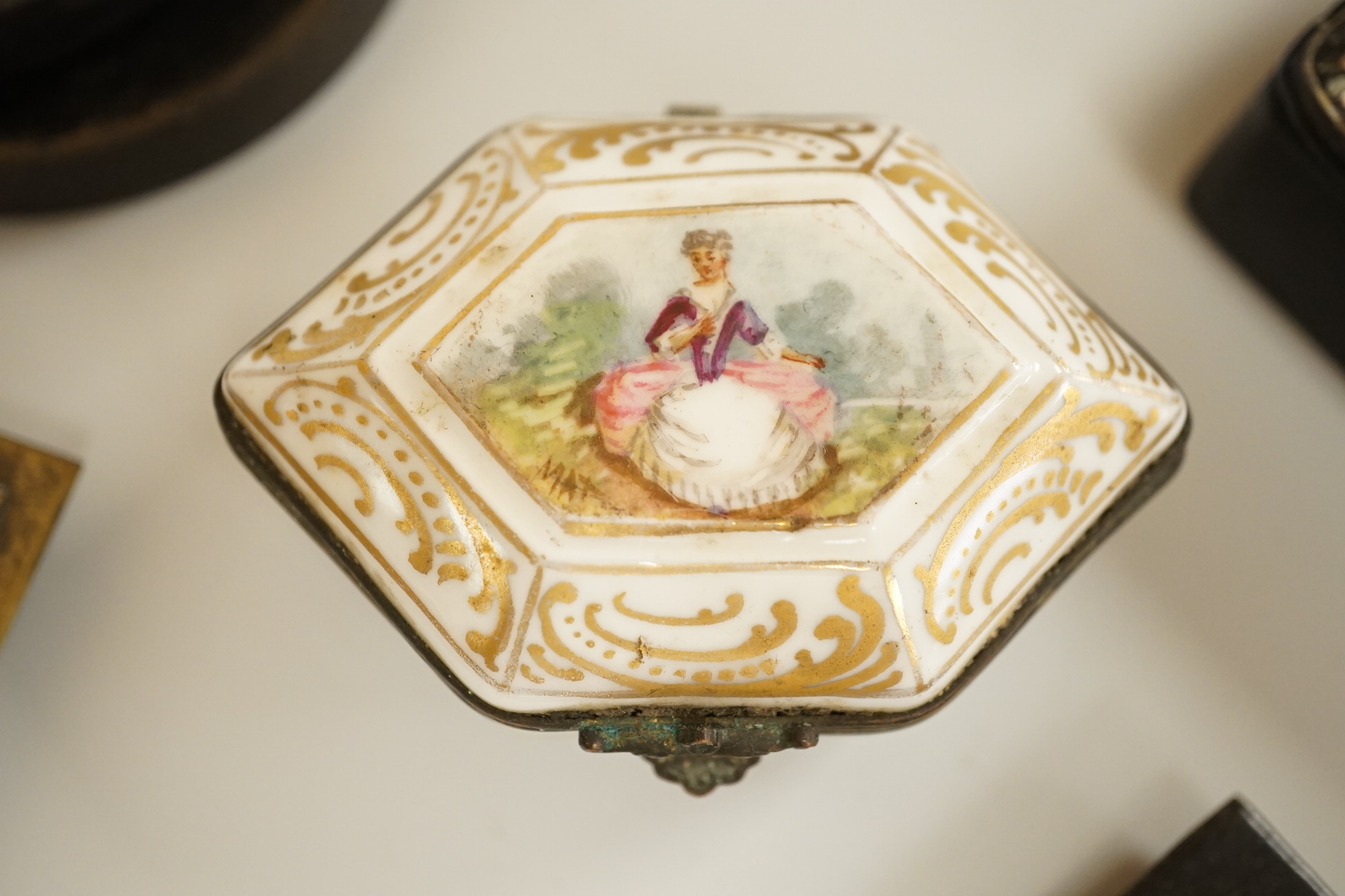 A collection of 19th century and later snuff and pill boxes, a silhouette frame and a gilt metal frame